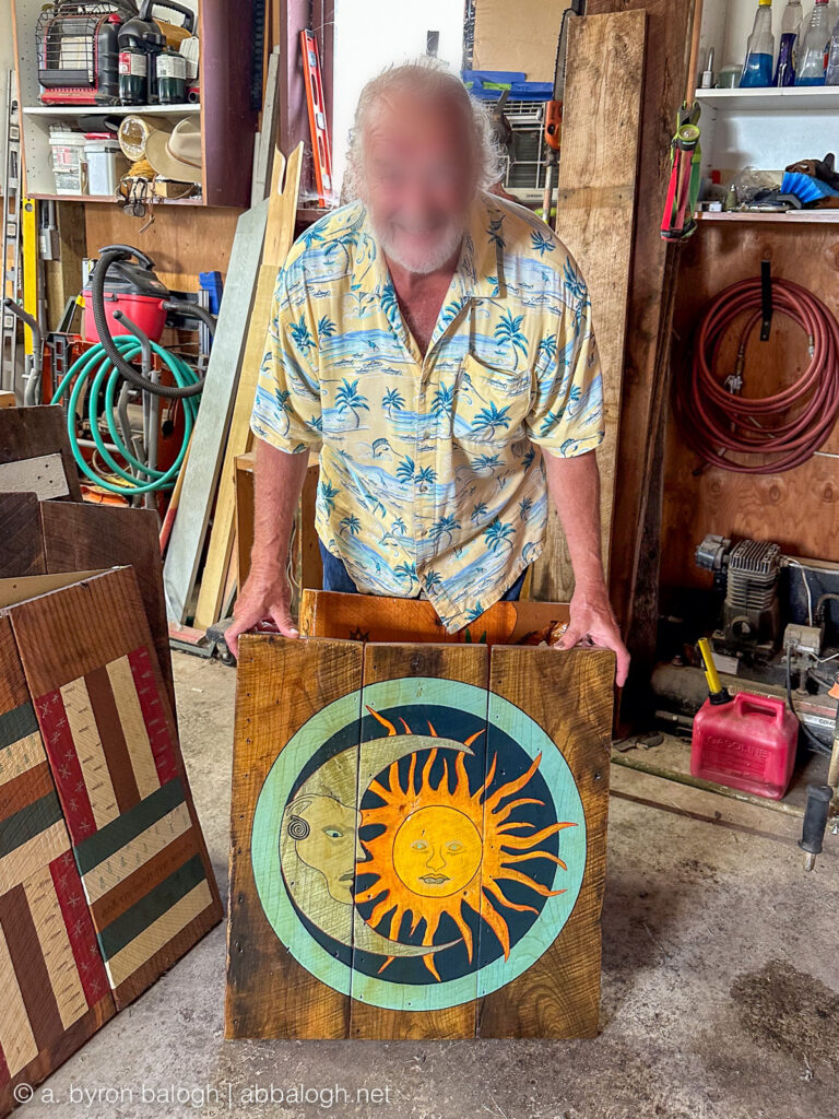 The artist of Blue Acres Farm and his hand-painted acrylic over 100-year-old reclaimed barn wood from Wisconsin